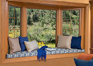 Stanek Window bay window with window seat with blue and tan cushions